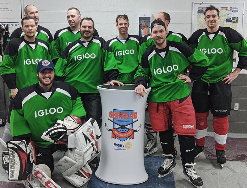 Hockey team with Igloo Jerseys posing for picture for Skate 48 Charity Hockey Events sponsored by the Rotary Club